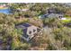Aerial view of house featuring a pool and lush landscaping at 4050 Rock Creek Dr, Port Charlotte, FL 33948