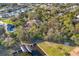 Aerial view of houses with boat docks on canal with lush landscaping at 4050 Rock Creek Dr, Port Charlotte, FL 33948