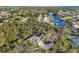 Stunning aerial view of home with pool, lush greenery, and picturesque waterway access at 4050 Rock Creek Dr, Port Charlotte, FL 33948