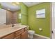 Bright bathroom featuring a single sink vanity, tiled shower, and modern fixtures at 4050 Rock Creek Dr, Port Charlotte, FL 33948