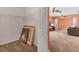 Spacious living room adjacent to closet with wire rack and views of the pool and patio at 4050 Rock Creek Dr, Port Charlotte, FL 33948