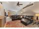 Spacious living room with vaulted ceilings, a comfortable leather sectional, and open-concept design at 4050 Rock Creek Dr, Port Charlotte, FL 33948