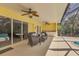 Screened in pool patio with seating and outdoor wet bar at 4050 Rock Creek Dr, Port Charlotte, FL 33948