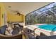 Screened in pool patio featuring outdoor seating and wet bar at 4050 Rock Creek Dr, Port Charlotte, FL 33948