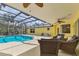 Relaxing screened-in pool area with plenty of seating and shaded outdoor space at 4050 Rock Creek Dr, Port Charlotte, FL 33948
