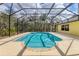 Screened in pool with a patio and a view of trees at 4050 Rock Creek Dr, Port Charlotte, FL 33948