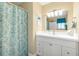 Full bathroom featuring vanity, toilet, mirror and shower at 414 Circlewood Dr # H2, Venice, FL 34293