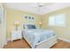 Charming bedroom featuring a comfortable bed, nightstands, and bright window at 414 Circlewood Dr # H2, Venice, FL 34293