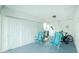 Organized carport with ample storage space, seating, and space for recreation, perfect for outdoor living at 414 Circlewood Dr # H2, Venice, FL 34293