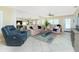 Inviting living room featuring comfortable seating, stylish decor, and ample natural light at 414 Circlewood Dr # H2, Venice, FL 34293