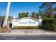 Welcoming entrance sign to Forest Park community, showcasing well-maintained landscaping and inviting atmosphere at 4260 Placida Rd # 11D, Englewood, FL 34224