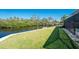 Expansive backyard with a canal view, perfect for waterfront living at 490 Creek Lane Dr, Englewood, FL 34223