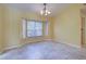 Dining room with a bay window, tile flooring, and chandelier lighting at 4966 Sunnyvale Rd, North Port, FL 34288