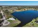 Beautiful aerial view of waterfront home boasting a private dock and circle drive at 5 Reef Ct, Placida, FL 33946