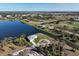 Aerial view of a waterfront home with private dock access and circle driveway at 5 Reef Ct, Placida, FL 33946