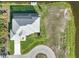 Aerial shot showcasing the roof and backyard of the home with a waterfront view at 5 Reef Ct, Placida, FL 33946