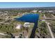 This aerial view shows the neighborhood, surrounding trees, and water features at 5 Reef Ct, Placida, FL 33946