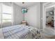 Bedroom with a sliding door closet, television, and a patterned bedspread at 5 Reef Ct, Placida, FL 33946