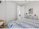 Bright bedroom boasting ample closet space and a view of the outside at 5 Reef Ct, Placida, FL 33946