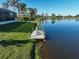 This aerial view captures a dock and beautiful lake at 5 Reef Ct, Placida, FL 33946