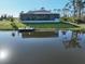 Exterior view of a screened-in porch home with a dock on the canal at 5 Reef Ct, Placida, FL 33946
