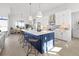 Stylish kitchen with a large island, white cabinets, stainless steel appliances, and an adjacent dining area at 5 Reef Ct, Placida, FL 33946