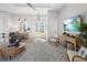 Open-concept living room with modern furnishings, natural light, and a seamless flow to the foyer at 5 Reef Ct, Placida, FL 33946