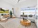 Elegant living room showcasing stylish furniture, a large rug, and access to an outdoor living space at 5 Reef Ct, Placida, FL 33946