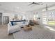 Bright living room with modern furniture, an open floor plan, and a view of the kitchen and front door at 5 Reef Ct, Placida, FL 33946