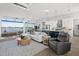 Open-concept living space with water views, modern kitchen, and stylish furnishings at 5 Reef Ct, Placida, FL 33946