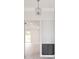 Open entryway featuring a decorative light fixture, cabinet, and expansive views into other rooms at 5213 Willow Lake Ct, Sarasota, FL 34233