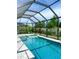 Private screened pool with a spa and plenty of seating at 5213 Willow Lake Ct, Sarasota, FL 34233