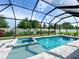 The pool is surrounded by a screened enclosure, which helps to keep the pool clean and free of debris at 5213 Willow Lake Ct, Sarasota, FL 34233