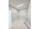 Empty walk-in closet with wire shelving and marble floors located next to the bathroom at 5213 Willow Lake Ct, Sarasota, FL 34233