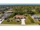 Aerial view of home featuring a large lot, meticulous landscaping, and a spacious driveway at 5441 Farley St, Port Charlotte, FL 33981