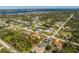 Aerial view showcasing the property's location within a beautiful, established neighborhood near the water at 5441 Farley St, Port Charlotte, FL 33981