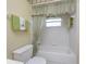 This is a bathtub with an updated shower curtain at 5441 Farley St, Port Charlotte, FL 33981