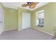 Bright bedroom features a large window, carpeted floor and a closet at 5441 Farley St, Port Charlotte, FL 33981