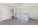 Comfortable bedroom with neutral carpet, white walls, and a ceiling fan at 5441 Farley St, Port Charlotte, FL 33981