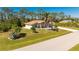 Well-maintained single-Gathering home with lush lawn, mature trees and landscaping at 5441 Farley St, Port Charlotte, FL 33981