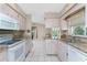 Kitchen with granite counters, stainless sink and appliances plus view to living room at 5441 Farley St, Port Charlotte, FL 33981