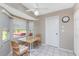 Cozy breakfast nook with fan, and windows with view to the back yard and hot tub at 5441 Farley St, Port Charlotte, FL 33981