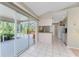 View of kitchenette with sliding doors to screened patio with a hot tub at 5441 Farley St, Port Charlotte, FL 33981