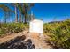 Outdoor shed with a small porch and easy access, surrounded by lush tropical vegetation at 5441 Farley St, Port Charlotte, FL 33981