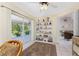 Bright sunroom featuring tiled flooring, large sliding doors and display shelving at 5441 Farley St, Port Charlotte, FL 33981