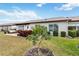 Cozy backyard patio with seating and garden, perfect for outdoor relaxation at 613 Chestnut Ln, Englewood, FL 34223