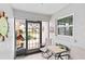 Cozy screened-in porch featuring tile flooring and outdoor seating at 613 Chestnut Ln, Englewood, FL 34223