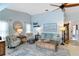 Cozy living room with a ceiling fan, beachy accents and comfortable seating at 613 Chestnut Ln, Englewood, FL 34223