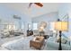 Comfortable living room with vaulted ceilings and abundant natural light at 613 Chestnut Ln, Englewood, FL 34223