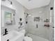 Modern bathroom featuring a glass-enclosed shower and sleek fixtures at 6264 Drucker Cir, Port Charlotte, FL 33981